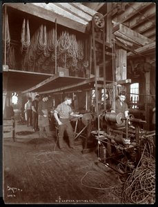 Interior view of a man working with leather at the New York Leather Belting Co., New York, 1906